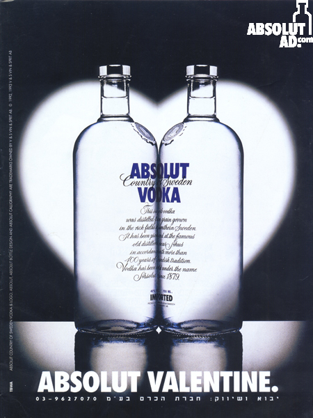 Two bottles facing each other in heart spotlight